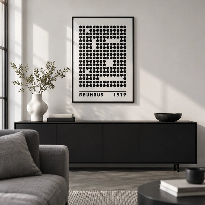 Bauhaus Prints, framed on the wall of a monochrome city-flat living room with a white wall and polished concrete