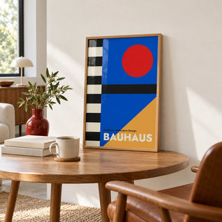 Bauhaus Style Poster, a small A4 framed print leaning on a round oak table