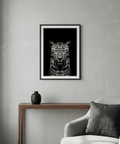 High-contrast leopard portrait wall art print on a black background