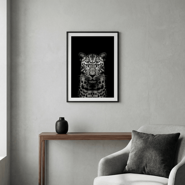 High-contrast leopard portrait wall art print on a black background
