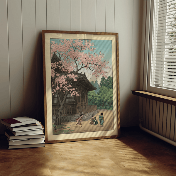 Angled desk display of Hasui Kawase Poster highlighting blossom canopy over architecture