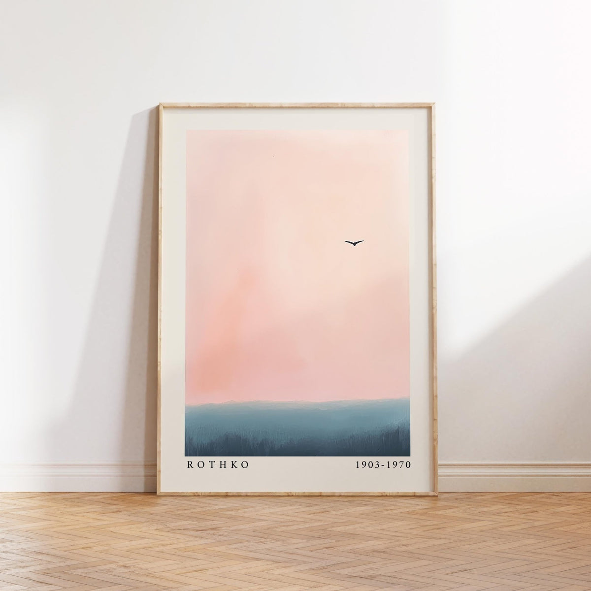 Pink and blue wall art with a minimalist ocean and sky horizon.
