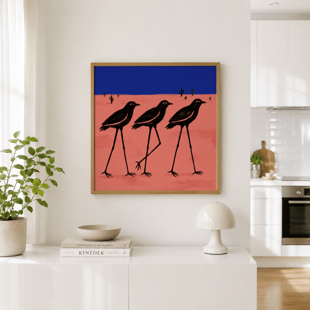 Stylized cactus landscape print highlighting black bird figures and open space