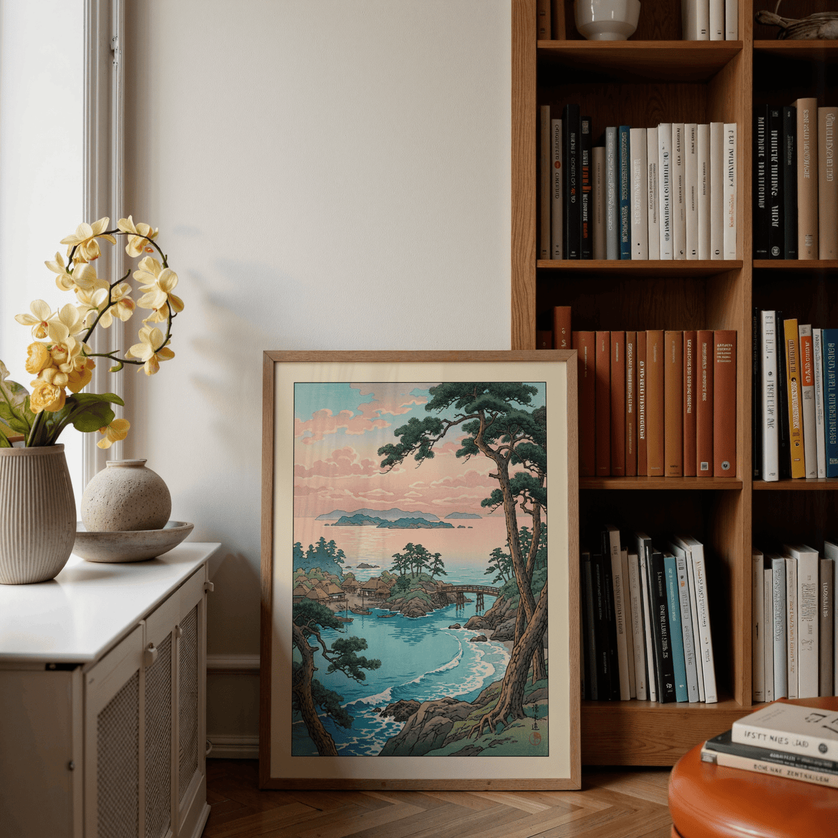 Shoreline village print with small boats, curved bridge, and pine branches framing the view