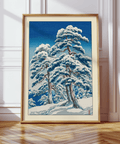 Framed view mockup of Hasui Kawase winter landscape print featuring snowy pine canopies