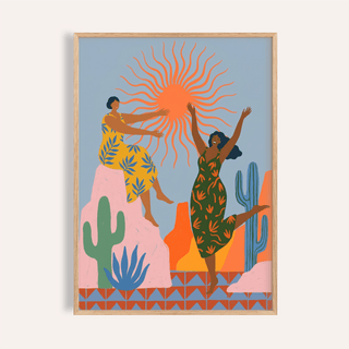 Framed Sunset Women Art Print showing two women with an orange sun and desert plants