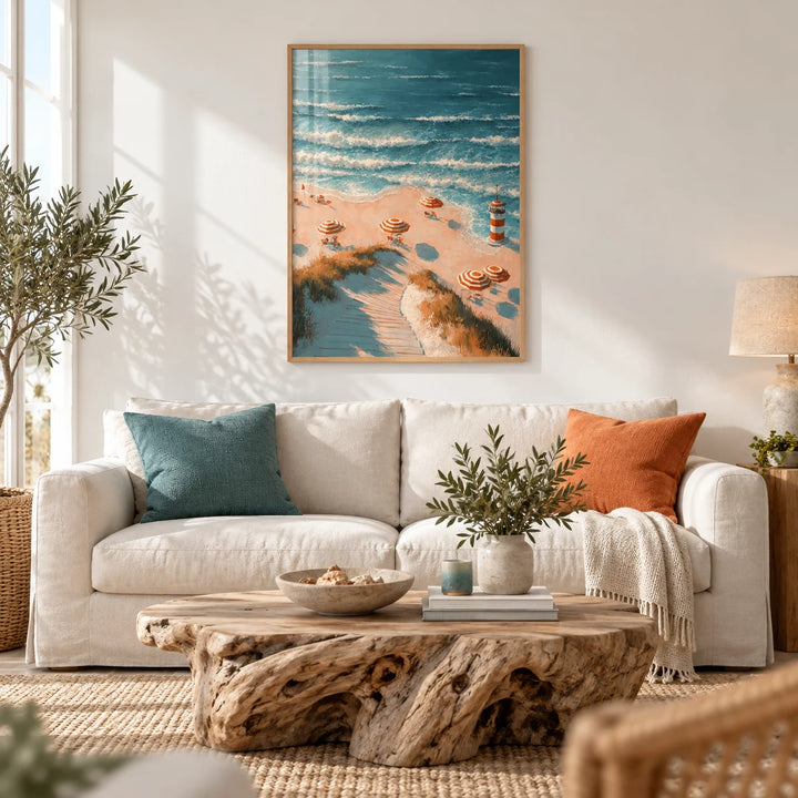 Beach Lighthouse Print, framed on the wall of a bright coastal living room with a white wall