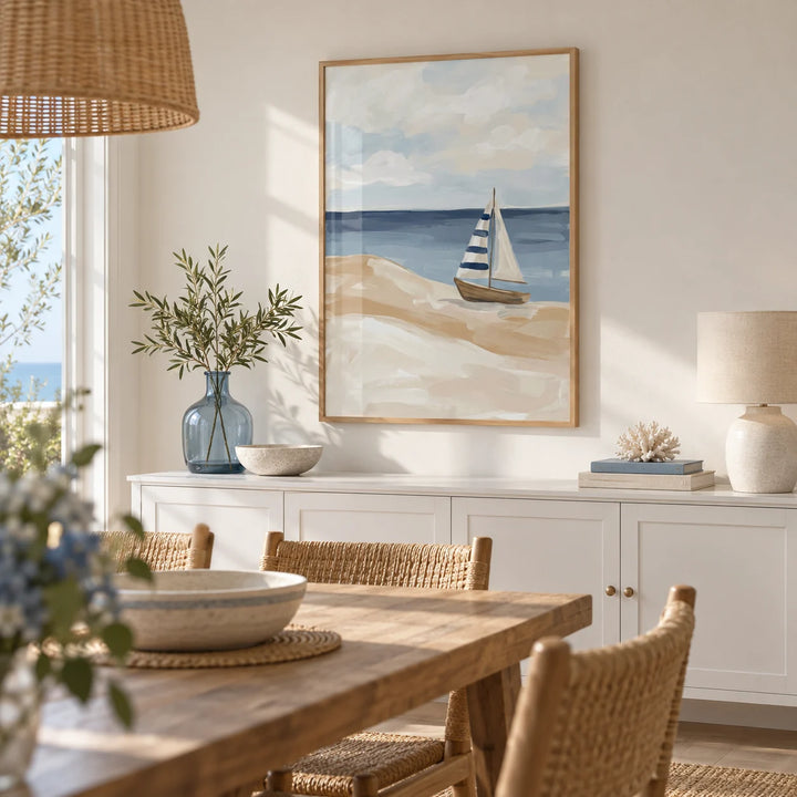 Beach Sailboat Wall Art, framed on the wall of a bright seaside dining room