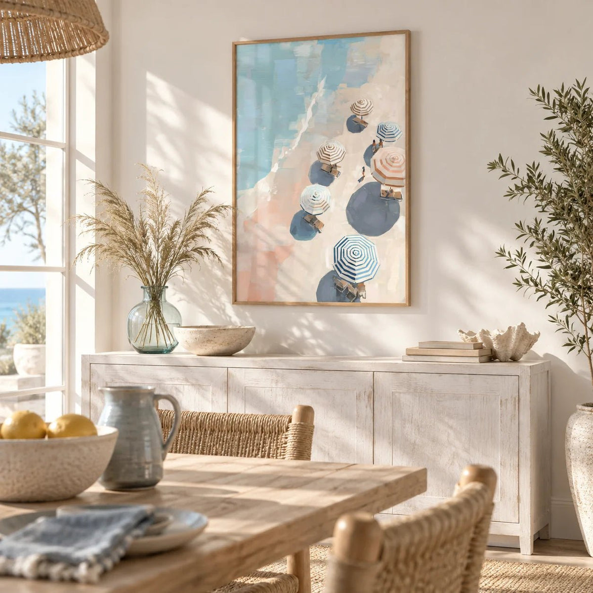 Beach Umbrella Print, framed on the wall of a breezy coastal dining room
