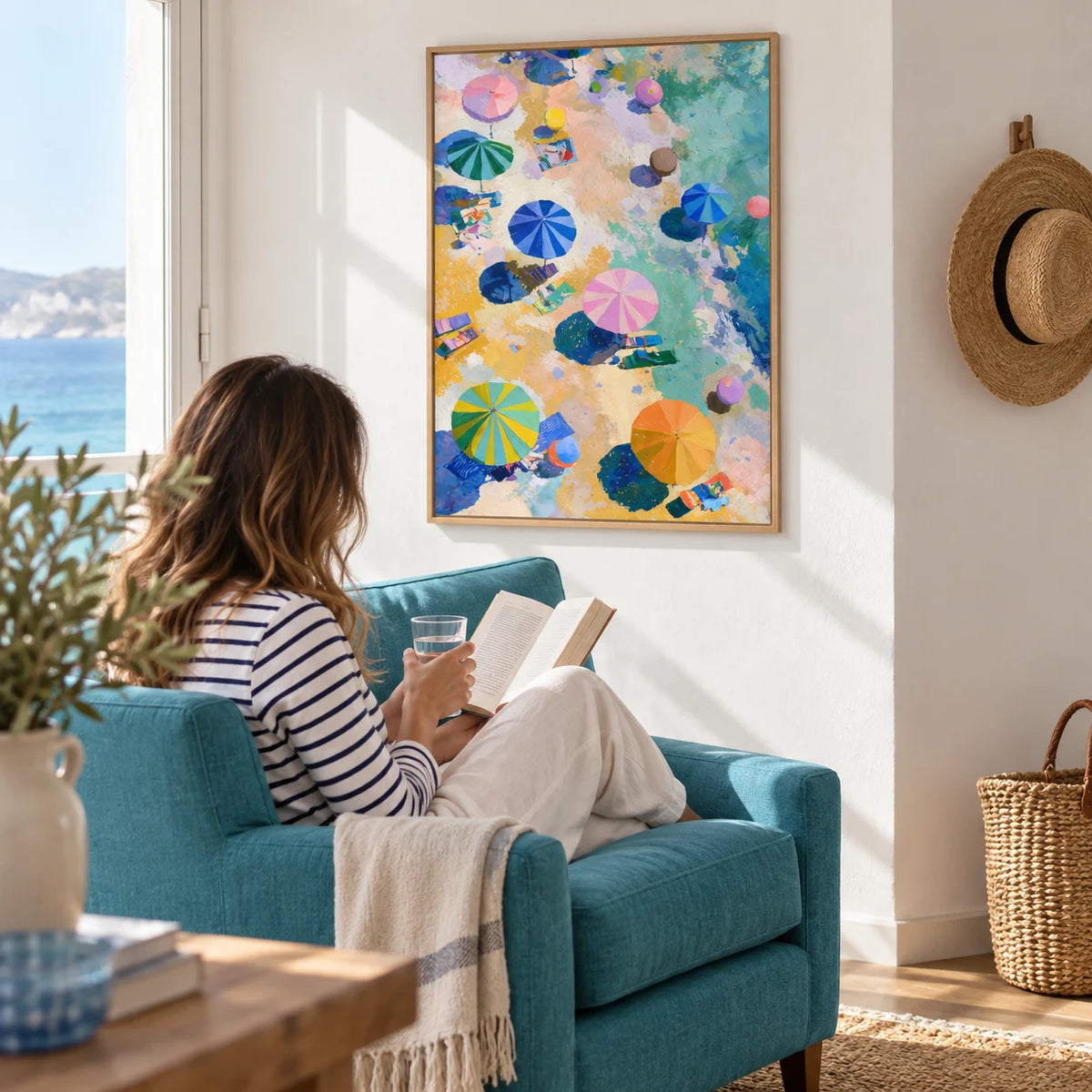 Beach Umbrellas Print, framed on the wall of a bright corner of a seaside flat with a white wall in a living room
