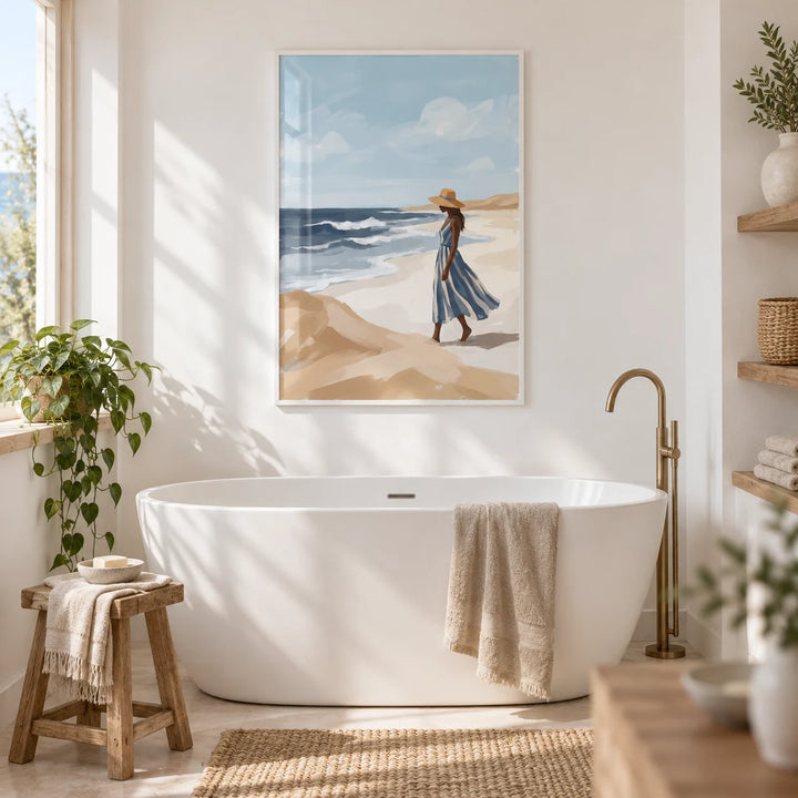 Beach Woman Art Print, framed on the wall of a bright coastal bathroom with white walls