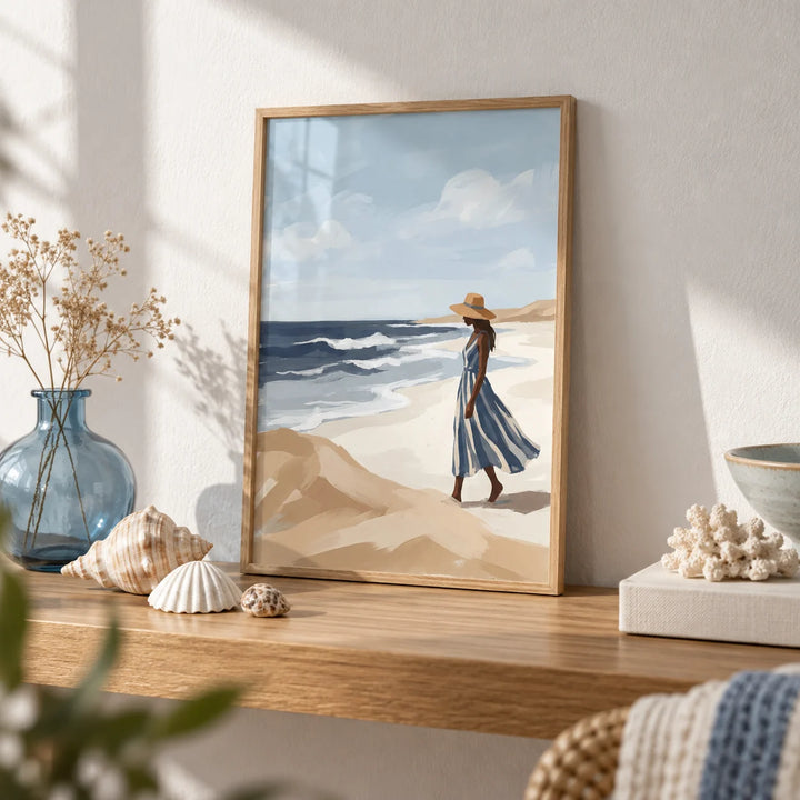 Beach Woman Art Print, a small A4 framed print leaning on an oak shelf in a living room