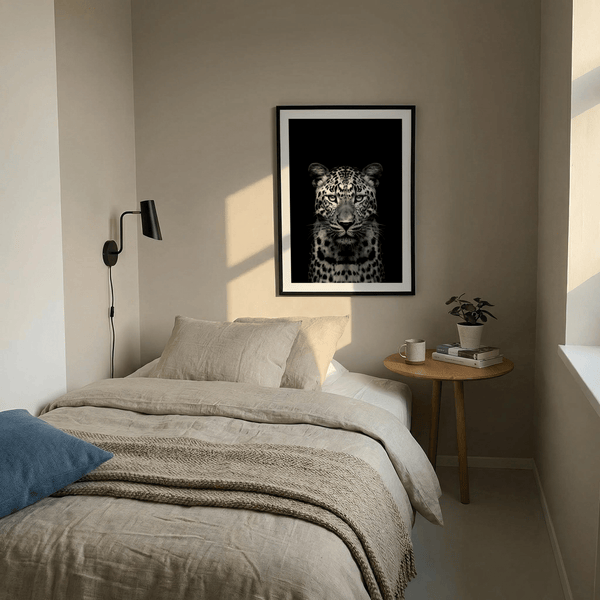 Monochrome wildlife wall art print showing leopard head-on against negative space