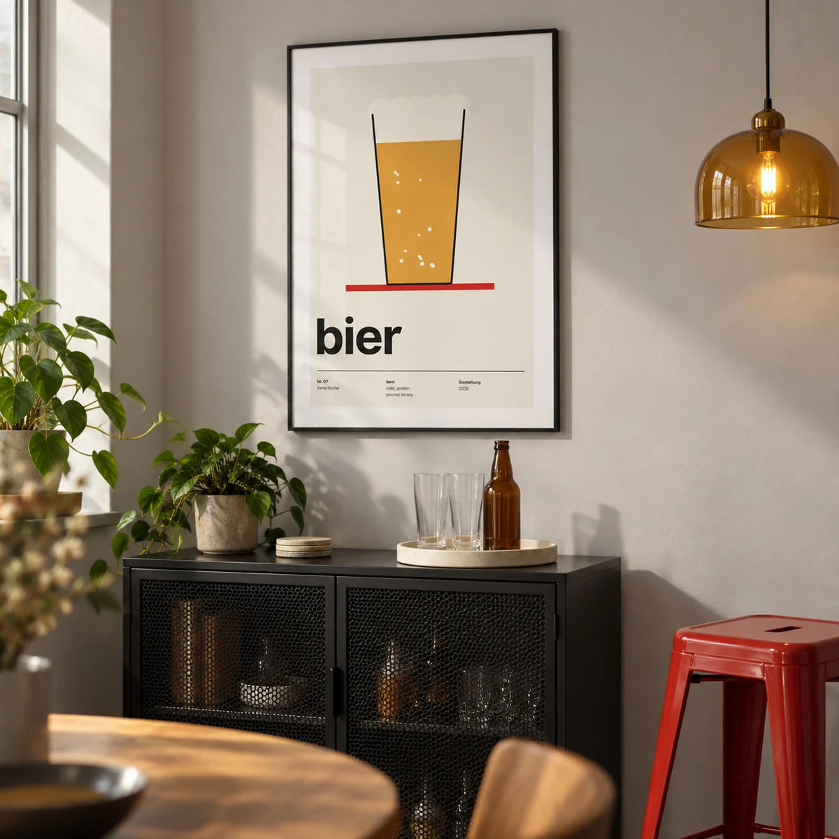 Beer Poster, framed on the wall of a compact home bar alcove in a modern UK flat with a pale grey wall and a black metal drinks cabinet in a living room