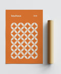 Orange poster inspired by Bauhaus 1919 design, printed with minimalist motifs.