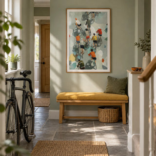 Bicycle Riders Wall Art, framed on the wall of a practical cyclist's hallway in a renovated UK terraced house with a pale sage wall and grey stone floor