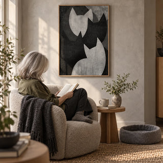 Big Cat Art, framed on the wall of a cosy reading corner with a pale grey limewashed wall in a living room