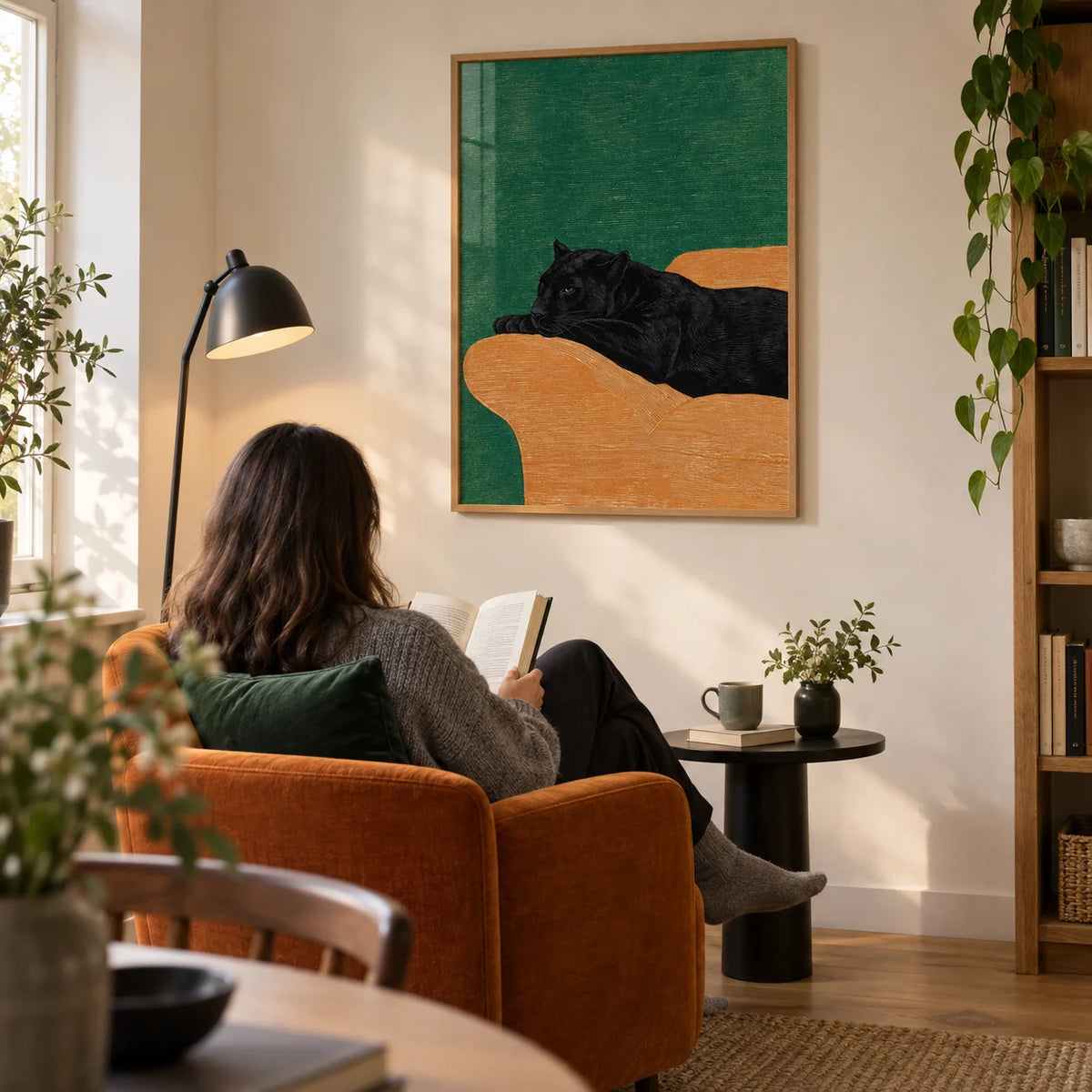 Big Cat Art Print, framed on the wall of a quiet reading corner in a modern UK home with a warm ivory wall and an oak floor in a living room