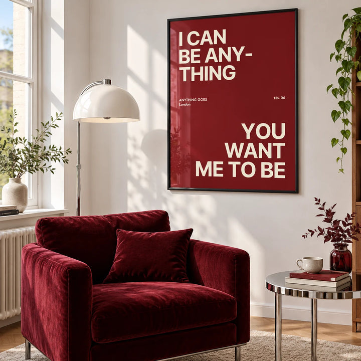 Big Text Poster, framed on the wall of a reading nook with a burgundy armchair in a living room