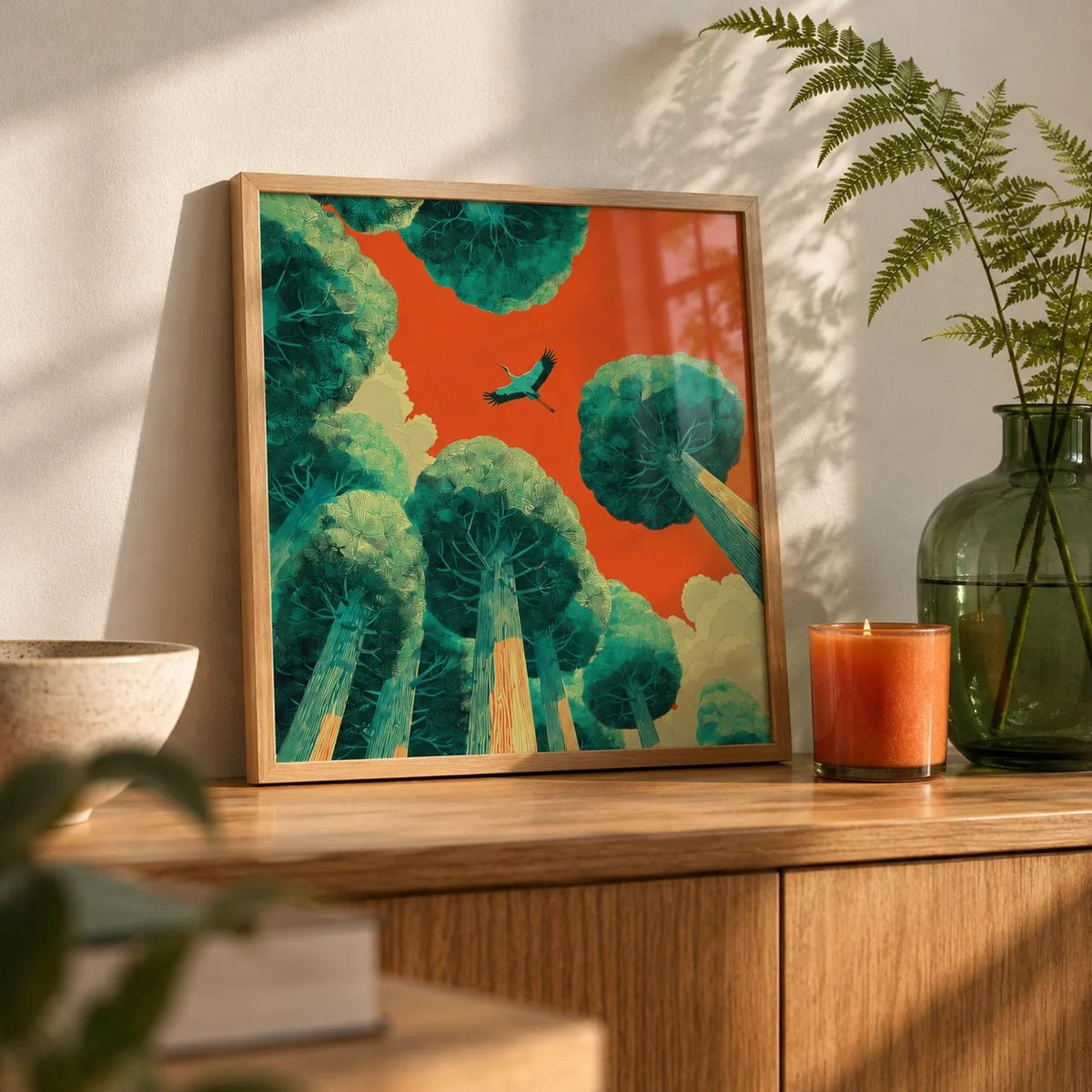 Bird In Flight Wall Art, a small A4 framed print leaning on an oak shelf in a living room