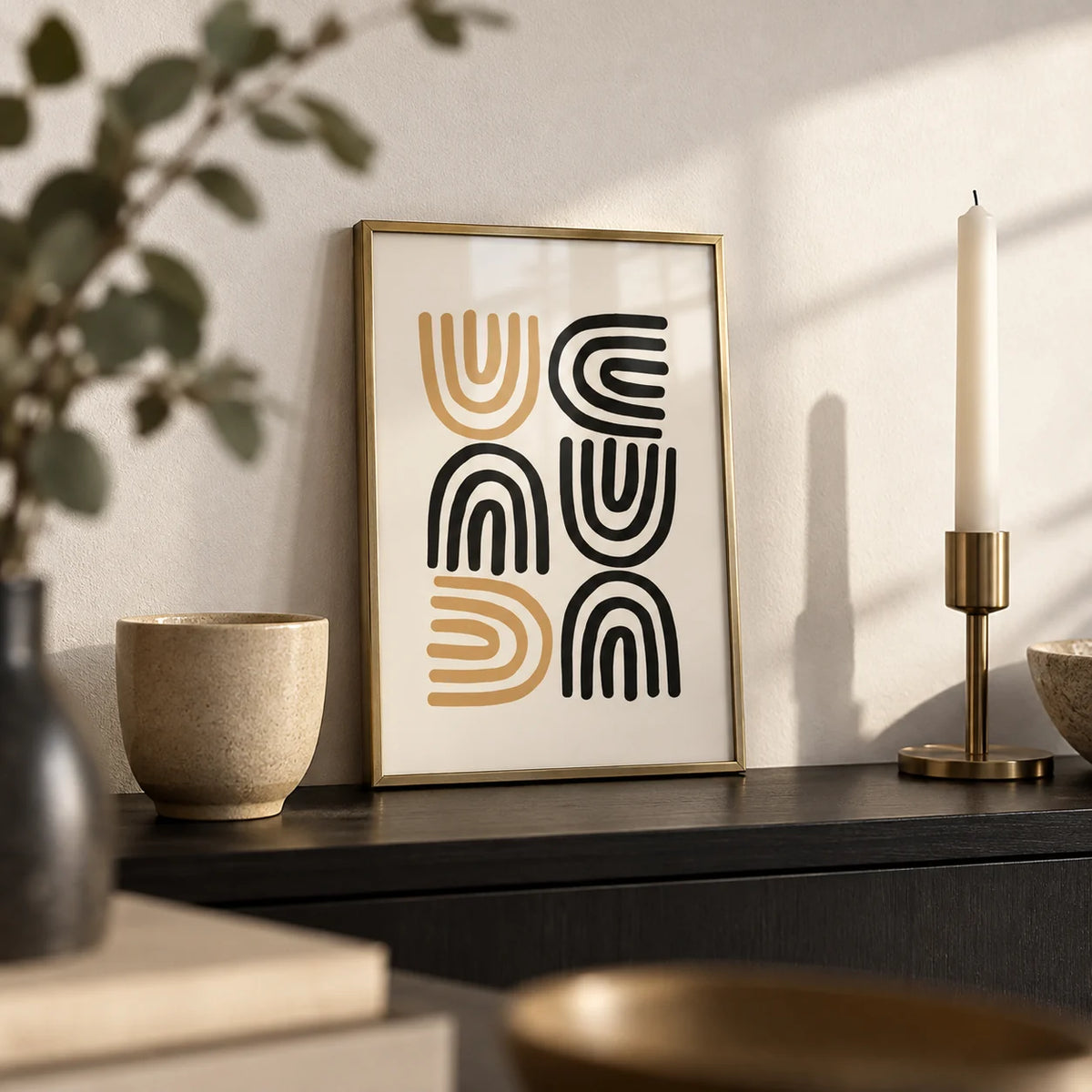 Black and Gold Pictures, a small A4 framed print leaning on a black shelf in a living room