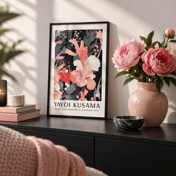 Black and Pink Wall Art, a small A4 framed print leaning on a black shelf in a living room