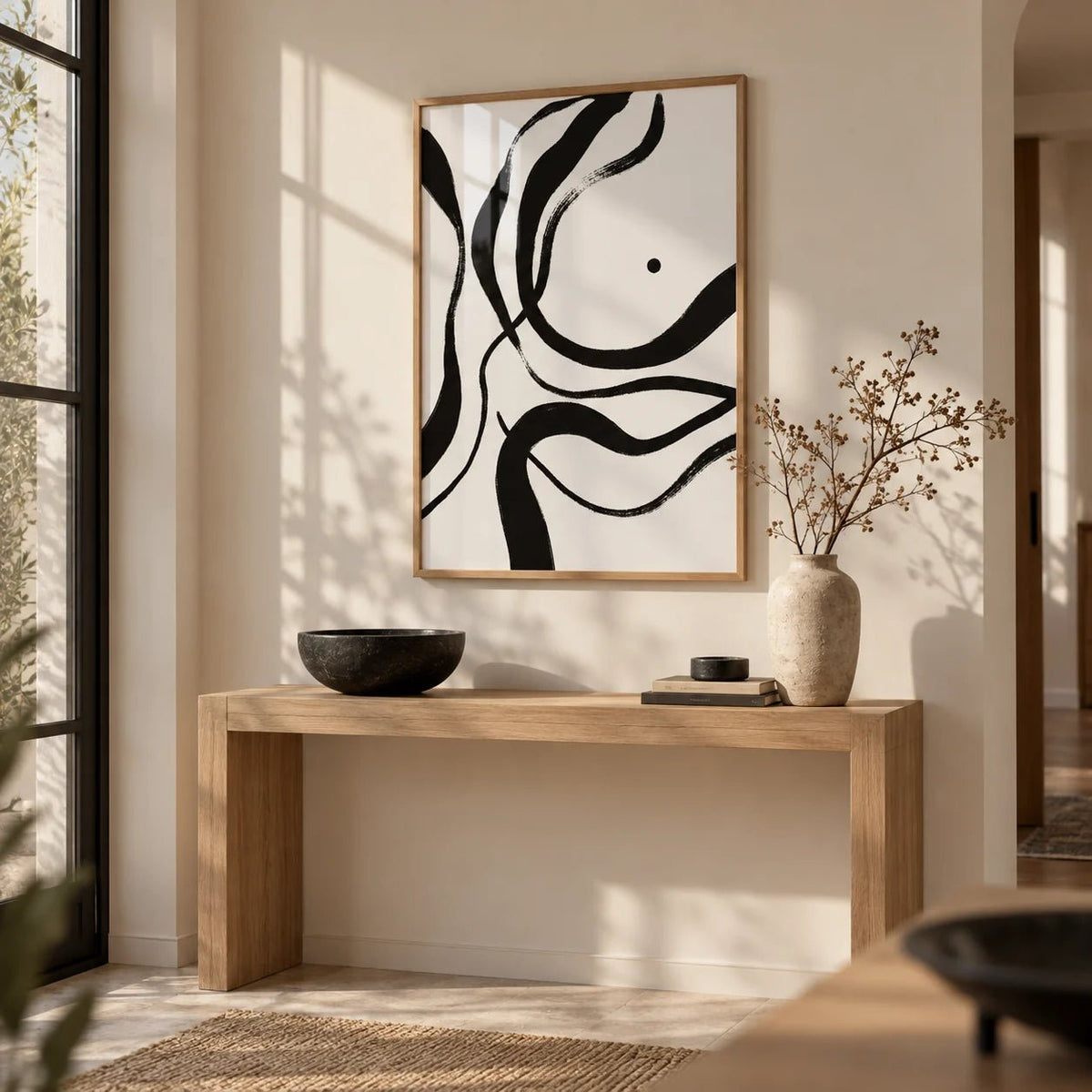Black And White Art, framed on the wall of a calm entryway