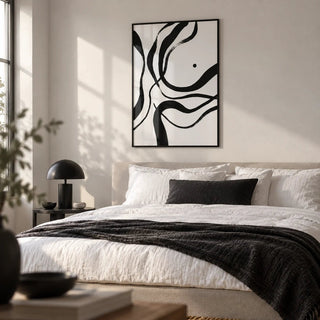 Black And White Art, framed on the wall of a crisp modern bedroom