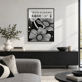 Black and White Art Flowers, framed on the wall of a crisp design-led city flat living room with a white wall and a polished concrete floor