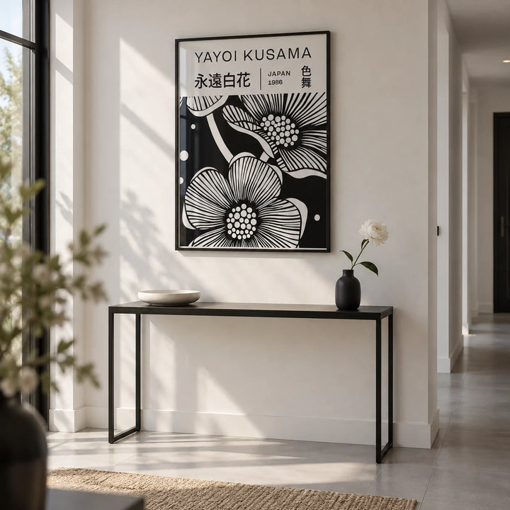Black and White Art Flowers, framed on the wall of a crisp hallway with a white wall and a pale grey floor