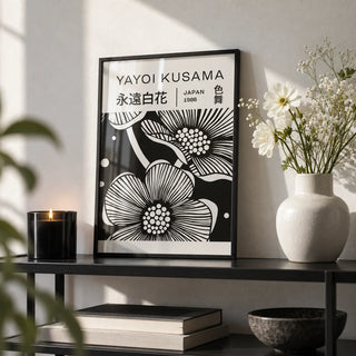 Black and White Art Flowers, a small A4 framed print leaning on a black metal shelf in a living room