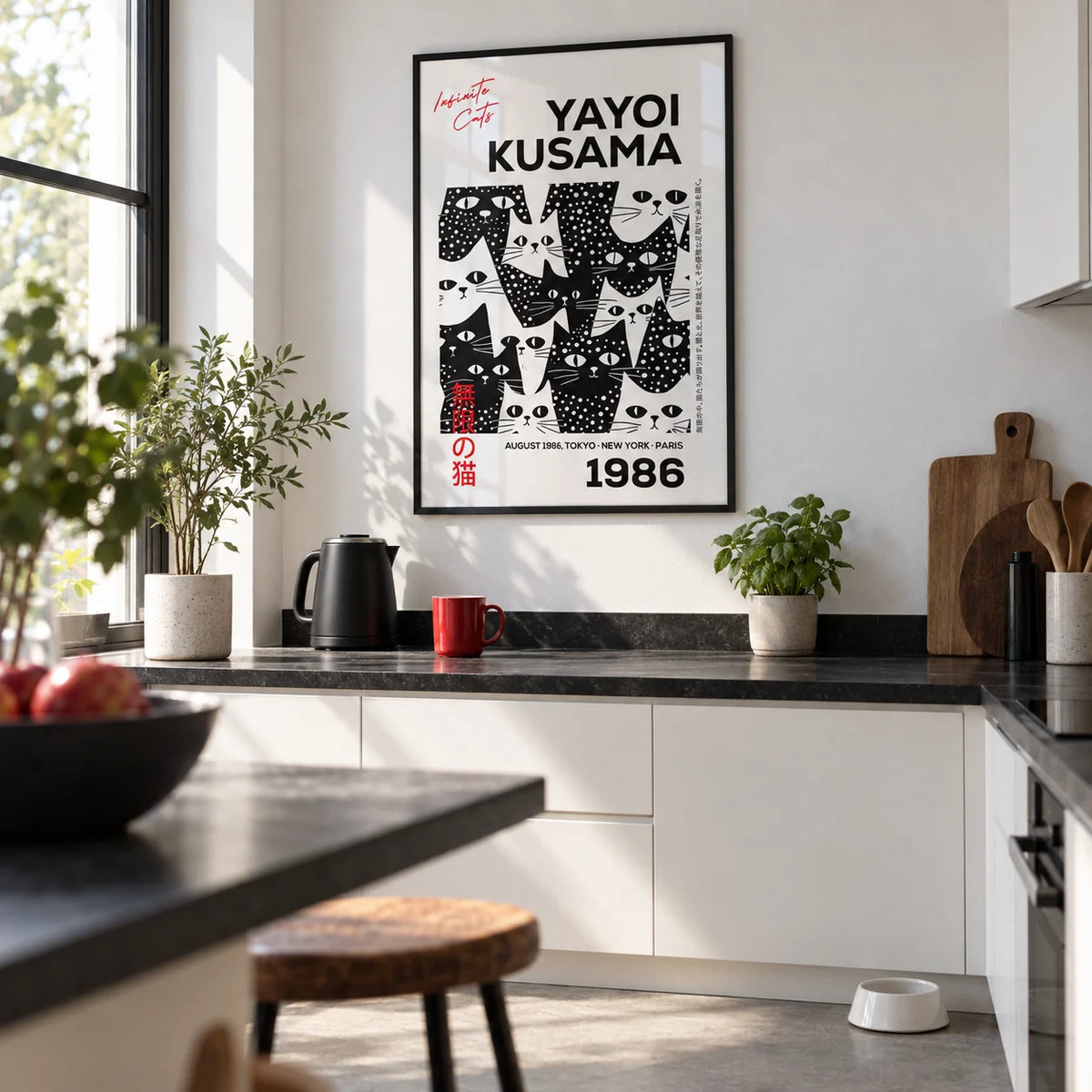 Black and White Cat Art, framed on the wall of a modern white kitchen with a black worktop