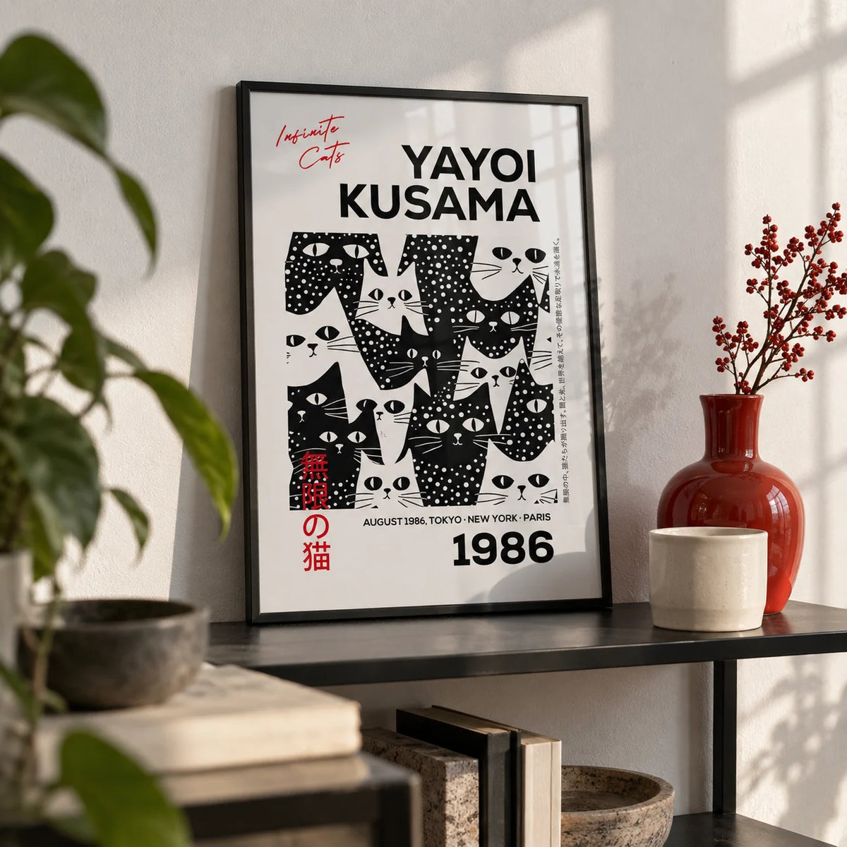 Black and White Cat Art, a small A4 framed print leaning on a black metal shelf in a living room