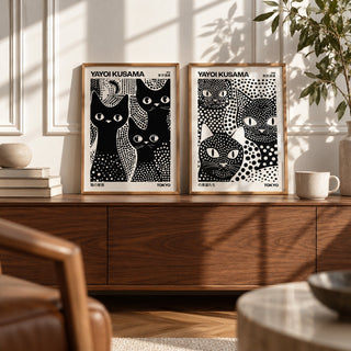 Black and White Cat Prints Set of 2 styled as small A4 prints on a shelf, to show the gift size: 3 Black Cats and Kusama Black Cats shown framed side by side (frames not included)