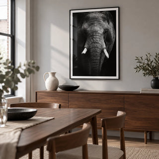 Elephant Print, framed on the wall of a modern dining room in a UK flat with a pale grey wall and a walnut dining table