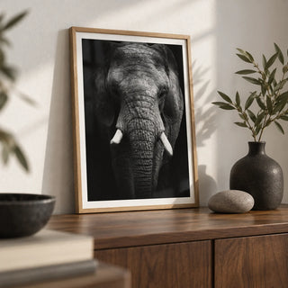 Elephant Print, a small A4 framed print leaning on a walnut side table in a hallway