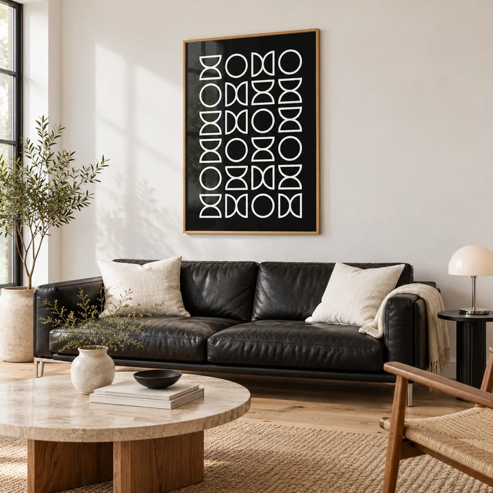 Black and White Geometric Art, framed on the wall of a monochrome living room with white walls and a pale oak floor