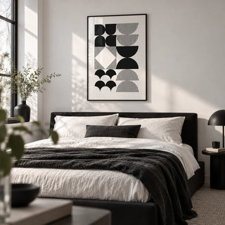 Black and White Geometric Wall Art, framed on the wall of a monochrome bedroom with a white wall