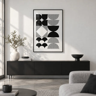 Black and White Geometric Wall Art, framed on the wall of a monochrome living room with a white wall and a polished concrete floor