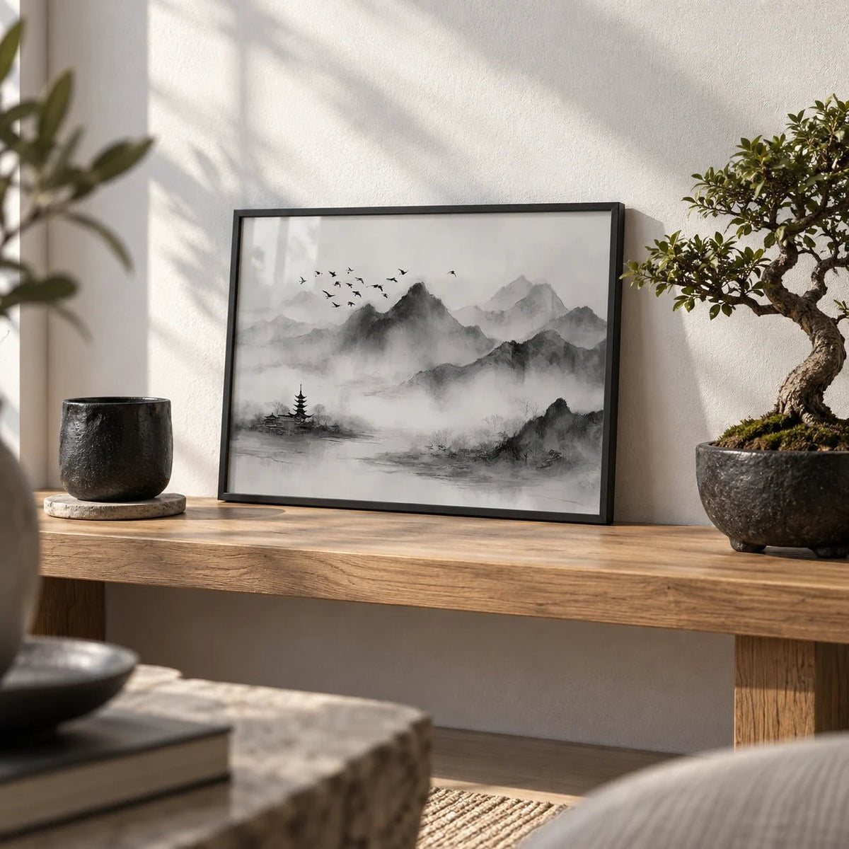 Black and White Landscape Print, a small A4 framed print leaning on a low oak bench in a living room