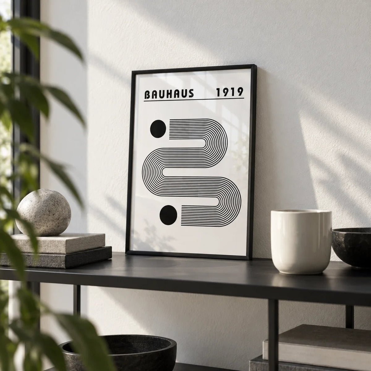 Black and White Minimalist Art, a small A4 framed print leaning on a black metal shelf in a living room