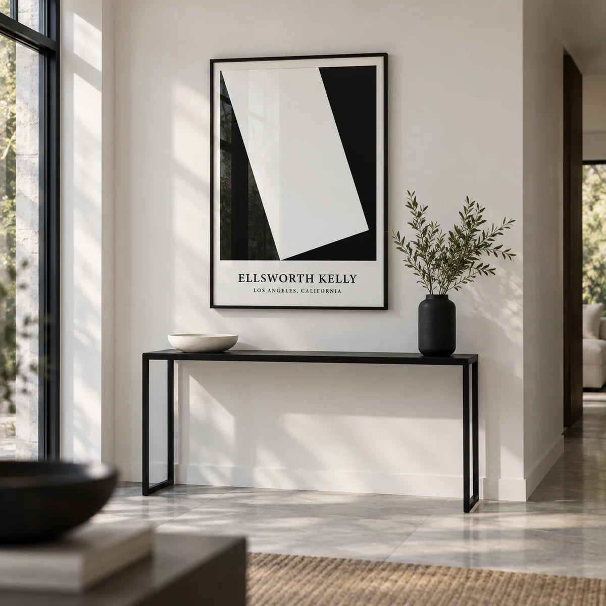 Black and White Office Print, framed on the wall of a gallery-like entrance hall with a white wall and a pale grey stone floor