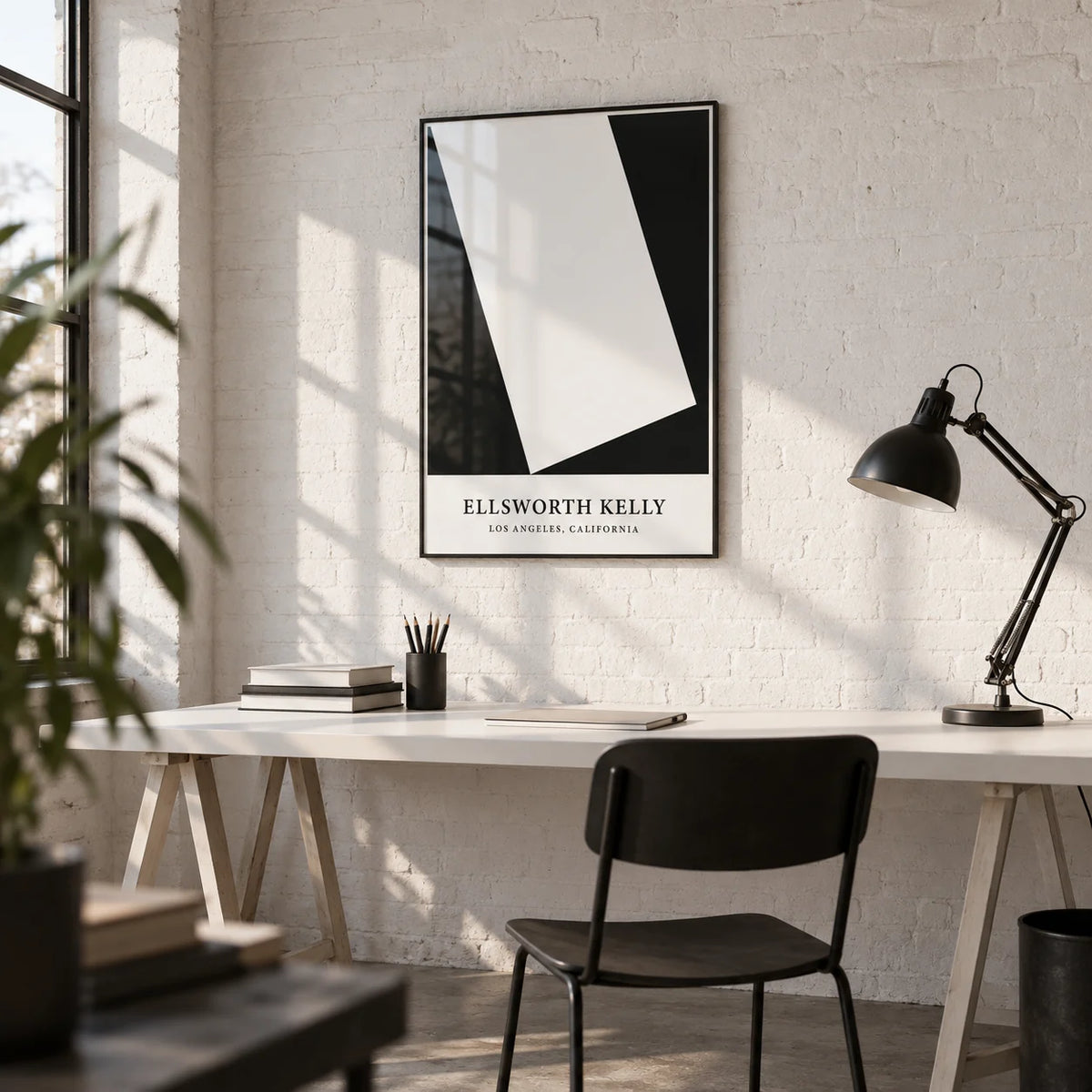 Black and White Office Print, framed on the wall of a minimal design studio with a white brick wall and a concrete floor
