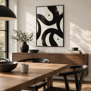 Black and White Posters, framed on the wall of a modern dining room with a white wall