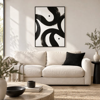 Black and White Posters, framed on the wall of a modern living room with a white wall and a pale oak floor
