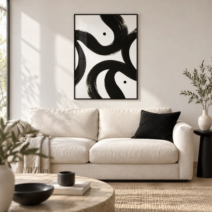 Black and White Posters, framed on the wall of a modern living room with a white wall and a pale oak floor