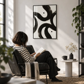 Black and White Posters, framed on the wall of a monochrome reading corner with a white wall in a living room
