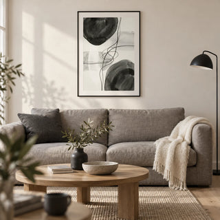 Black And White Wall Art, framed on the wall of a calm contemporary living room in a UK city flat with an off-white plaster wall and pale oak floor
