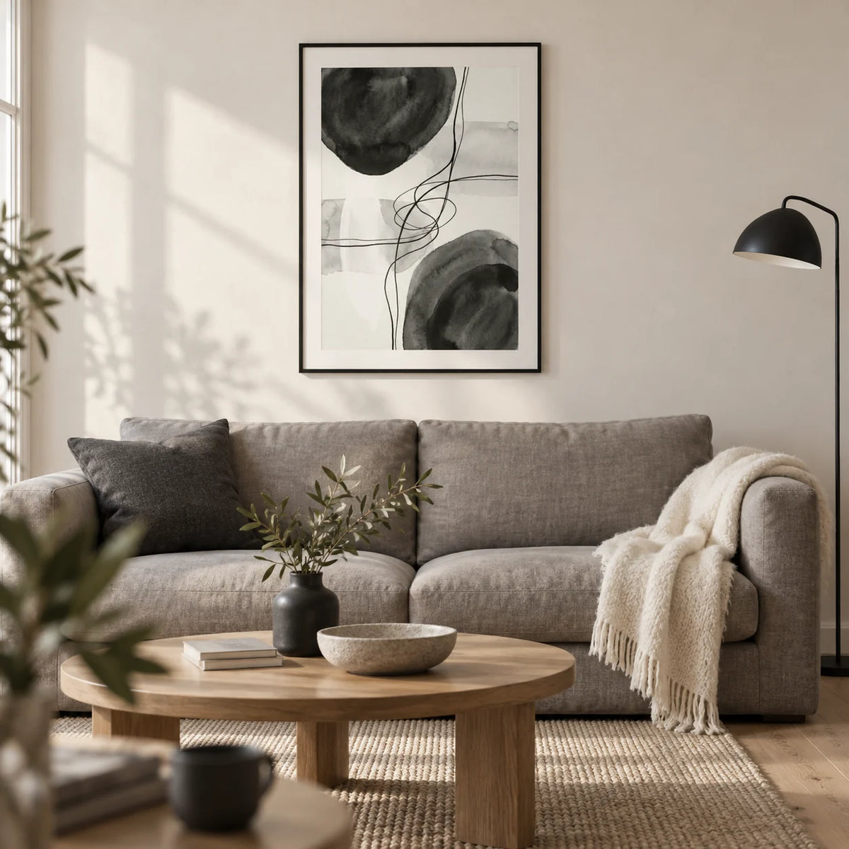 Black And White Wall Art, framed on the wall of a calm contemporary living room in a UK city flat with an off-white plaster wall and pale oak floor
