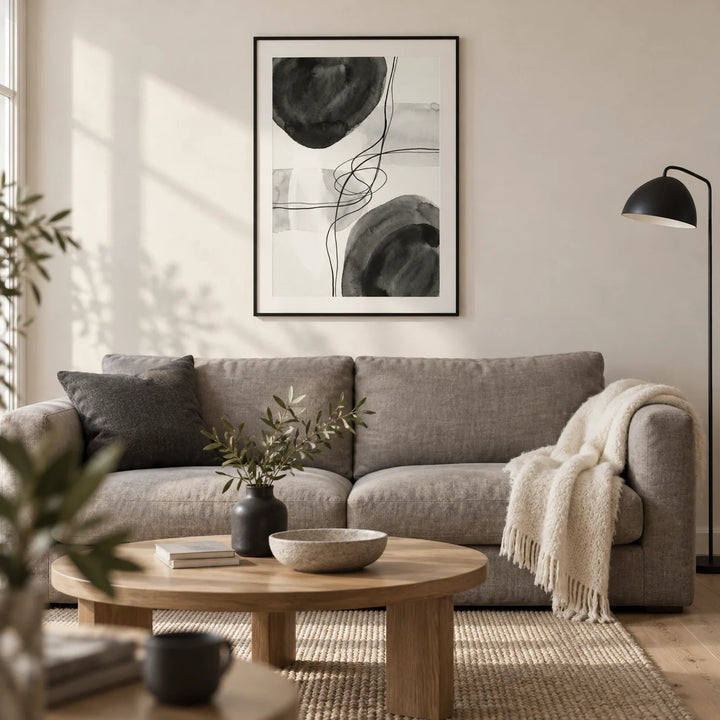 Black And White Wall Art, framed on the wall of a calm contemporary living room in a UK city flat with an off-white plaster wall and pale oak floor